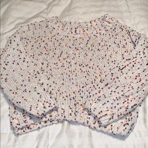 White sweater with rainbow details